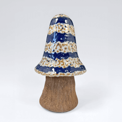 Photo of mushroom-striped-blue-mottled-white sculpture.